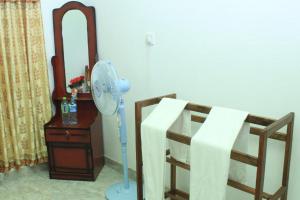 Letto o letti in una camera di Keerthi Homestay