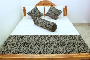 Letto o letti in una camera di Keerthi Homestay
