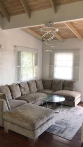 a living room with a couch and a table at Holiday home in DʼArbeau