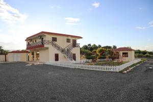 a house with a playground in a parking lot at Villa Rocio - Country Villa with pool in SJM