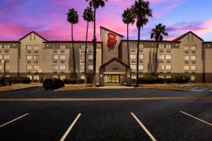 a hotel with a parking lot in front of it at Red Roof Inn Tucson North - Marana in Tucson