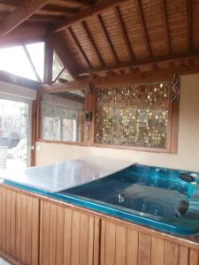 a large swimming pool in a kitchen with a pool at Au lézard doré in Lamonzie-Montastruc