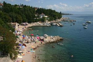 a group of people on a beach in the water at Apartment Elena in Dramalj +11 photos