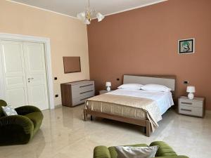 Postel nebo postele na pokoji v ubytování Palazzo Galzerano