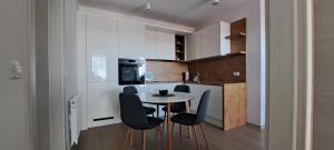 a small kitchen with a table and chairs at Apartment Varaždin in Varaždin