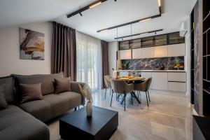 a living room with a couch and a table at Luxury Suite All You Need in Dubrovnik