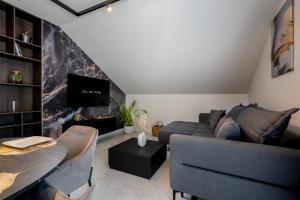 a living room with a couch and a fireplace at Luxury Suite All You Need in Dubrovnik