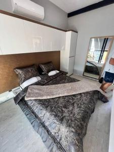 a bedroom with two beds and a mirror in it at Boutique hotel with a heat pool in Dosemealti +22 photos