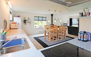 a kitchen and dining room with a table and chairs at Beautiful Home In Grevinge With Wifi in Grevinge