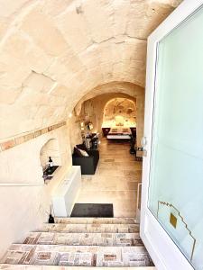 a hallway of a house with a stone wall at CASA VACANZE BB 164-166 in Matera