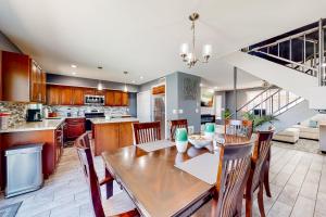 a kitchen and dining room with a wooden table and chairs at Paradise Palms in Scottsdale