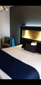 Postel nebo postele na pokoji v ubytování Belrom Hotel