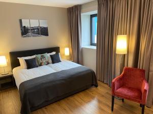 Ένα ή περισσότερα κρεβάτια σε δωμάτιο στο Hotel Monvillage
