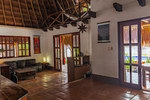 a living room with a couch and a table at Bed & Breakfast Casaejido in Playa del Carmen