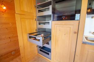 a refrigerator with its door open in a kitchen at Le Surf 1 in Mussillon