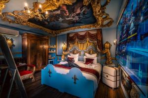 Postel nebo postele na pokoji v ubytování Hôtel Pirates World