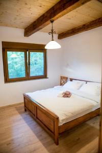 a bedroom with a large bed in a room at Villa Stanko Međugorje in Čapljina