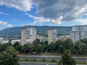a view of a city with tall apartment buildings at King Size Apartment in Skopje