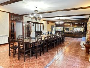 a large dining room with a long table and chairs at Quinta Escondida da Avessadas in Avessadas