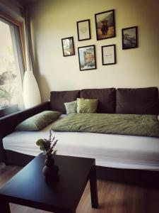 a living room with a couch and a table at Jack's Apartment in Werfenweng