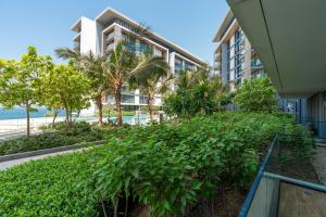 a view of a building with trees and plants at Brand new 1 BHK in Bluewaters in Dubai