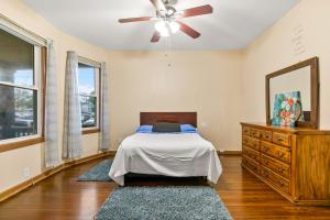 a bedroom with a bed and a ceiling fan at Bedroom near Yale Hospital/Bridgeport in Bridgeport