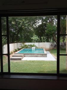 Piscina de la sau aproape de BK's Villa at Kensville Golf & Country Club
