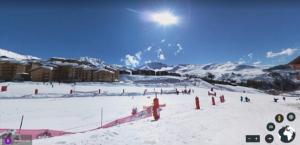 a group of people skiing on a snow covered slope at Plagne Soleil - Montsoleil -Ski aux pieds-5 personnes in Plagne Villages