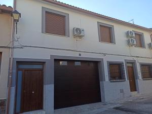 a building with two garage doors at Conde Lucanor in Belmonte