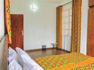 Letto o letti in una camera di GRACE LODGE ONITSHA