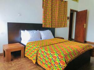 Letto o letti in una camera di GRACE LODGE ONITSHA