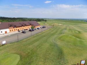 an aerial view of a golf course with a building at Hotel Golf Bitozeves in Bitozeves