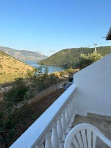 a balcony with a view of a lake at Ksamildream in Ksamil