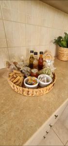 a basket of food on a counter with food on it at Ornament: Infinite Nature Villa in Dhafnés