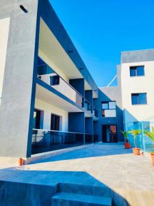 a large building with blue and white at Laguna Grey in Mangalia