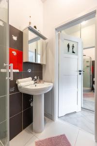 a bathroom with a sink and a shower at Vintage Senacka 9/7 Apartment in Krakow