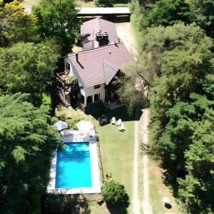 an overhead view of a house with a swimming pool at Posada La Lucía - Adults Only in Villa General Belgrano