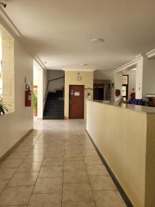 a lobby of a hospital with a reception counter at Apartamento em São Lourenço-mg in São Lourenço