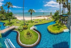 an aerial view of a resort with blue water at Luxurious Beachfront Pattaya in North Pattaya