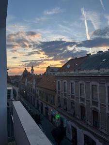 a view of a city with buildings and a sunset at CENTRAL VIEW APARTAMENT in Arad +5 photos