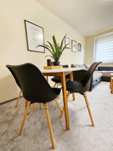 a dining room with a table and two chairs at Ferienwohnung in Weißenfels