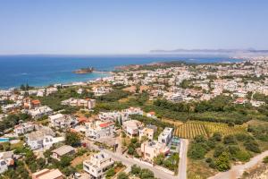 an aerial view of a city and the ocean at Anna Boutique Apartment in Kato Daratso +45 photos