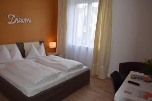 Voodi või voodid majutusasutuse Stadthotel Gürtler toas