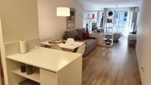 a living room with a couch and a table at Fabuloso departamento con todo y cerca de todo in Buenos Aires