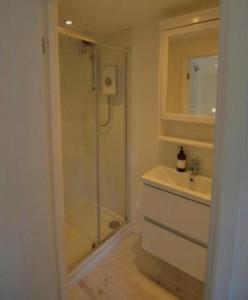 a bathroom with a shower and a sink at The retreat in West Mersea