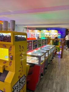 a row of slot machines in a candy store at 28 Roman’s Parade in Belton