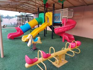 a playground with many different types of playground equipment at AlMazyona Chalet إستراحة المزيونه للتأجير in As Suwayq