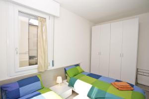 a bedroom with two beds and a window at Venice Residence Elisabeth in Mestre