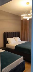 Lova arba lovos apgyvendinimo įstaigoje SUPREME Luxury Hotel