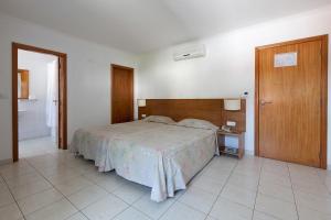 מיטה או מיטות בחדר ב-Hotel Solmar